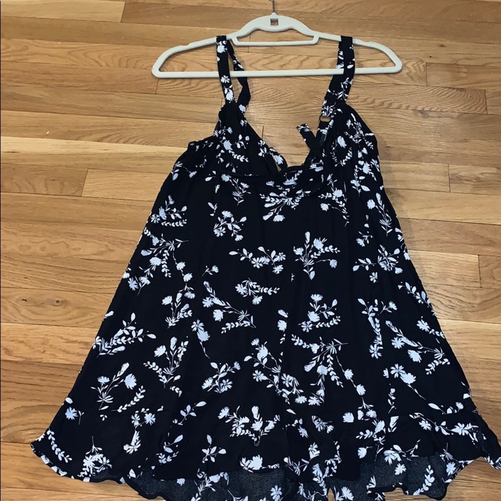 Black and white floral romper with ruffled shorts